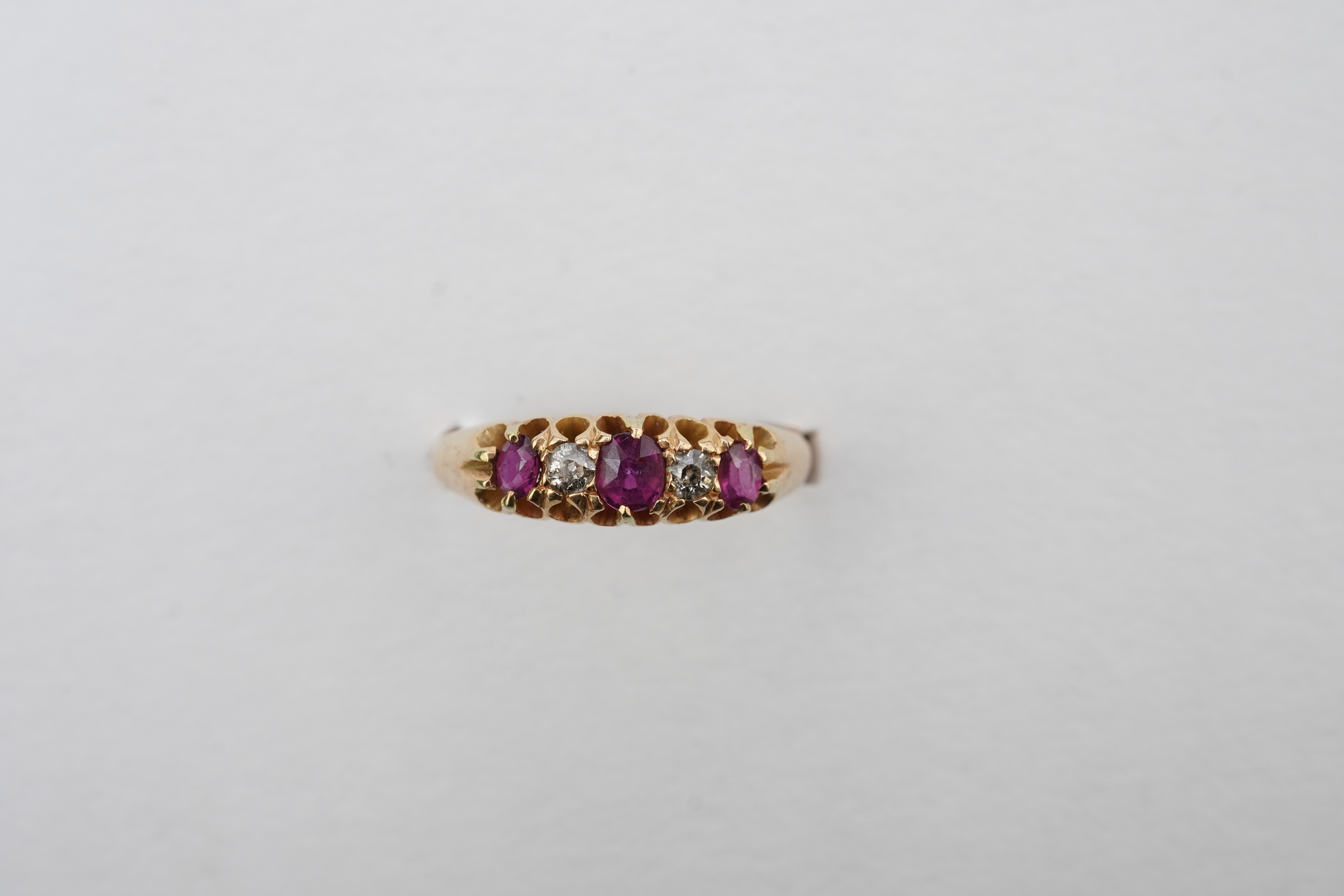 A ruby and diamond five-stone ring, circa 1900